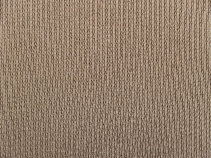 a close up of a tan background textured with thin, horizontal ridges