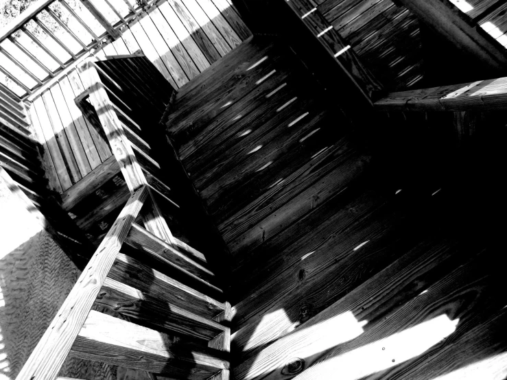 a wood bench is sitting on top of some stairs