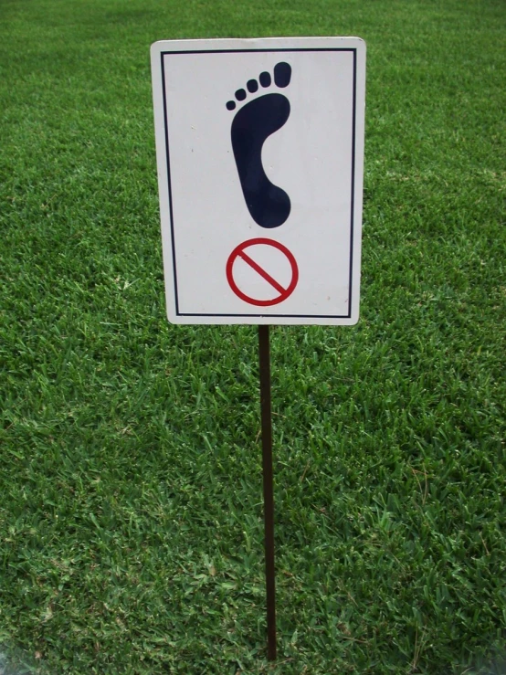 a sign that has a small foot on it
