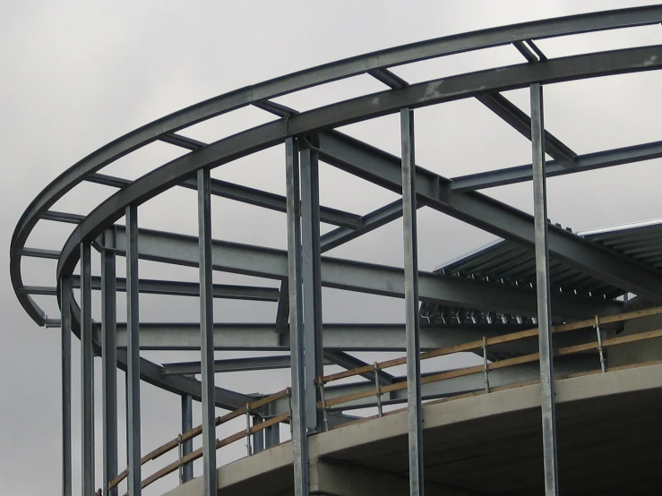 the metal staircase is positioned up next to the steel roof