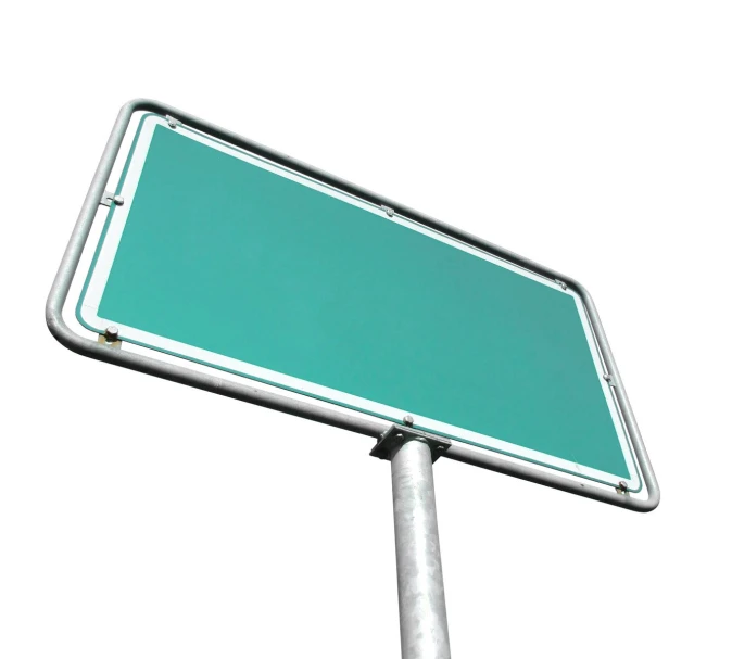 a green and white street sign is shown