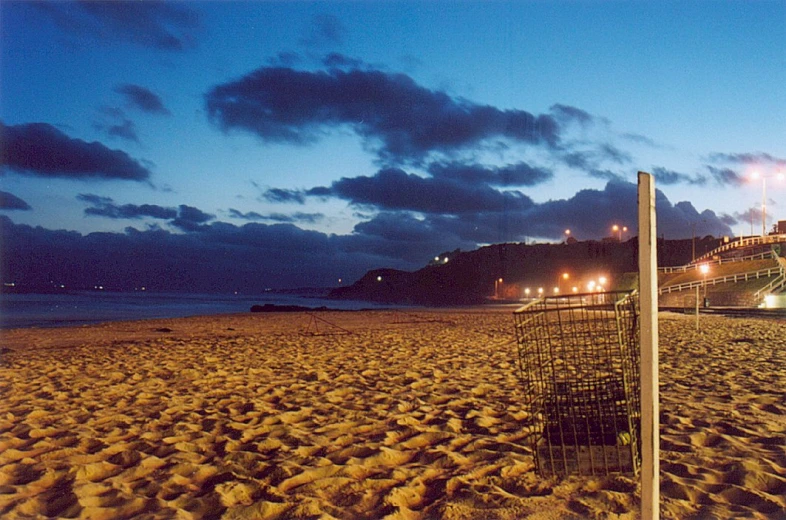 a volleyball ball that is in the sand