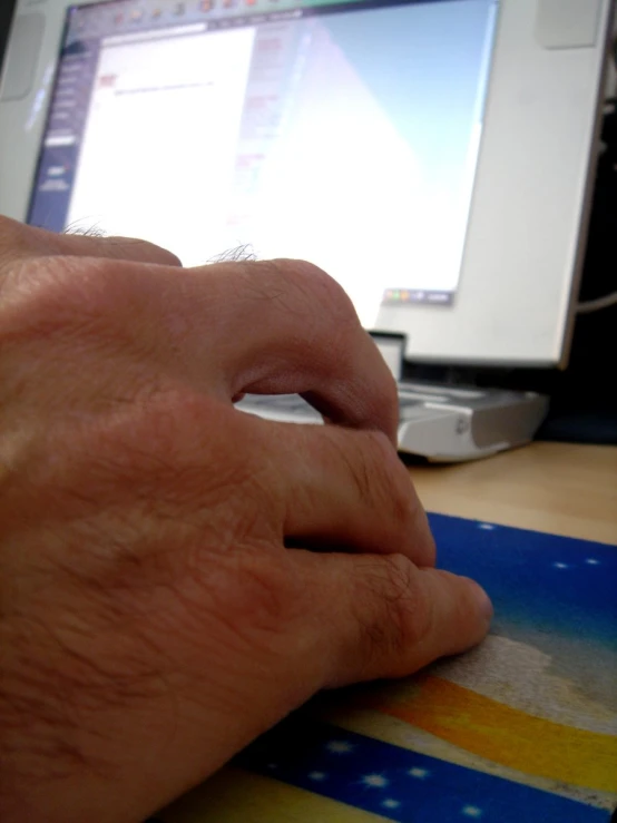 a man is shown using a computer mouse