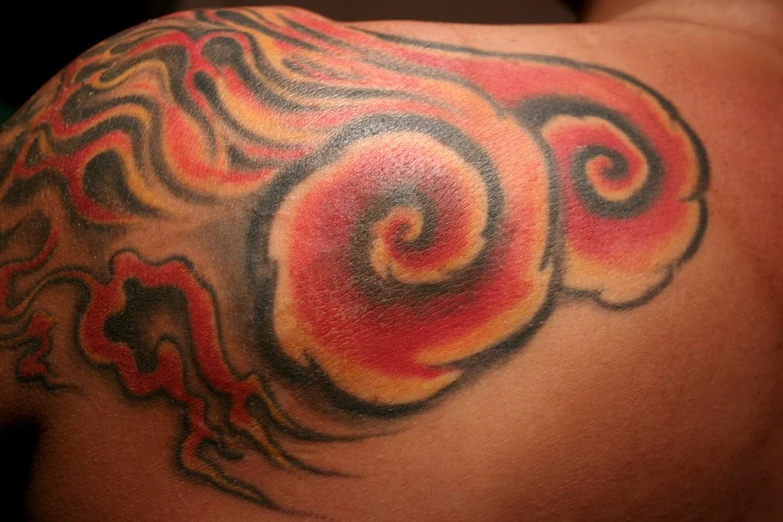 tattoos on the back of the shoulder are colorful