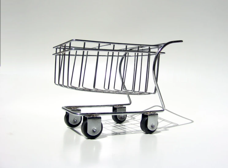 a plastic shopping cart with black wheels and black tire