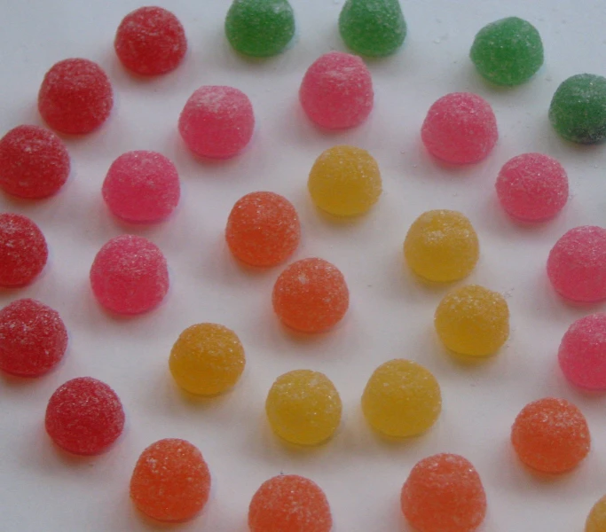 a number of candies on a white surface