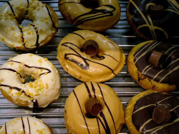 an assortment of different flavored donuts with chocolate glaze