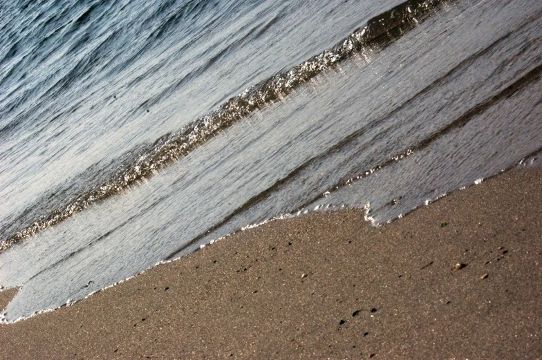 a wave in the water at a beach