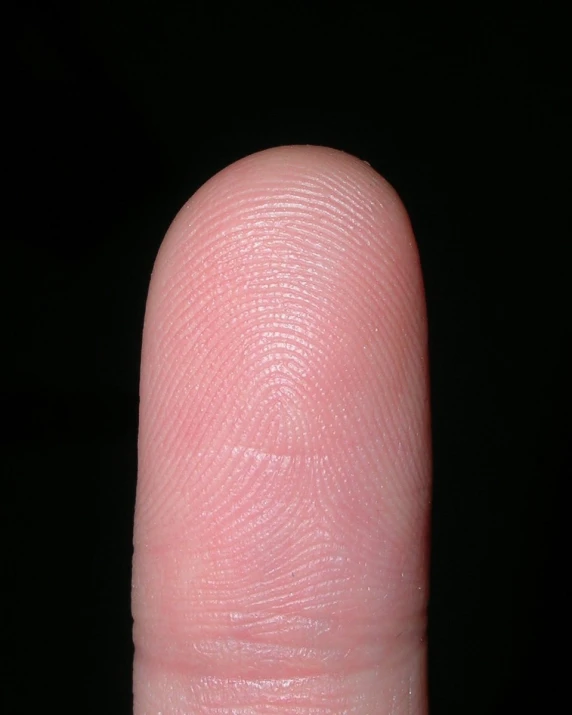 the thumbnail of a person's thumb on black