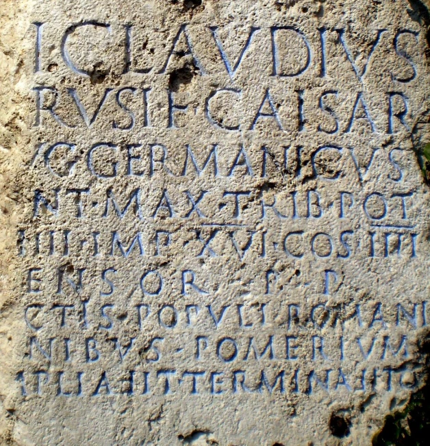 some writing on cement near green grass