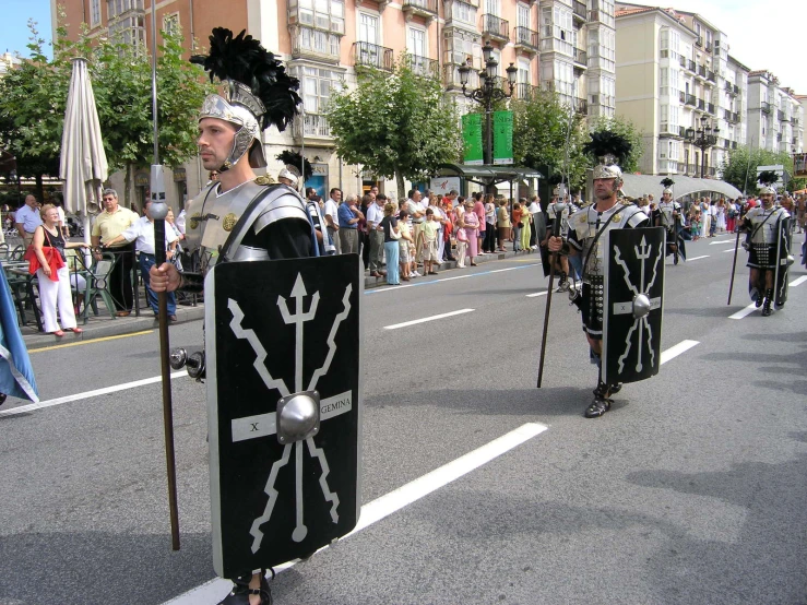 men in costumes are marching down the street