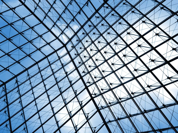 looking up at the roof of a glass building