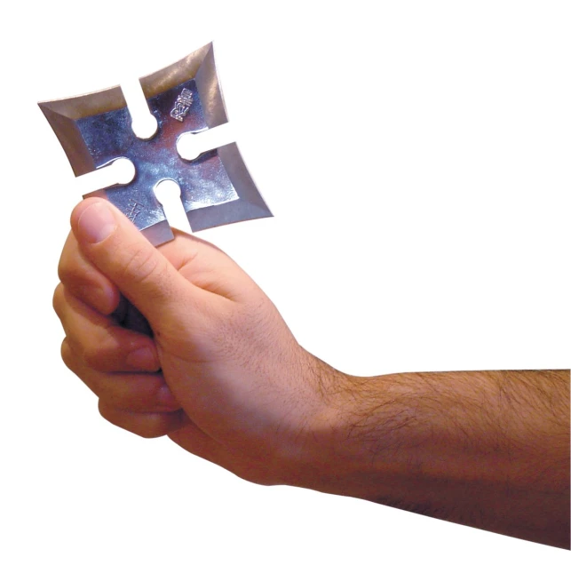 a person holding a piece of puzzle in their hand