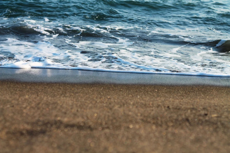 an object is sitting on the sand of the beach