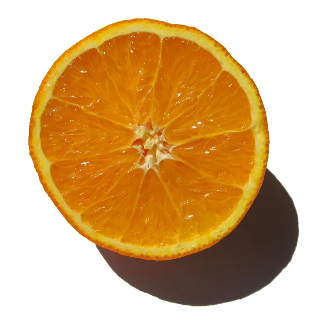 a ripe orange is on the floor