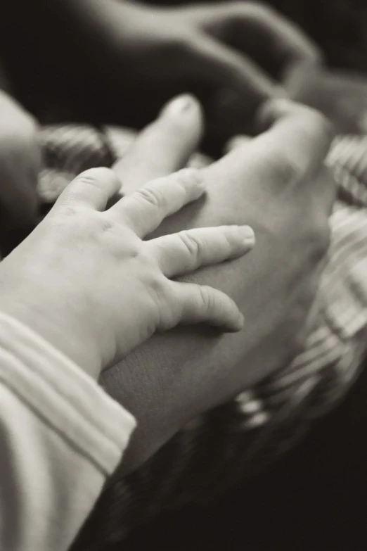 two people are holding each other and touching their hands