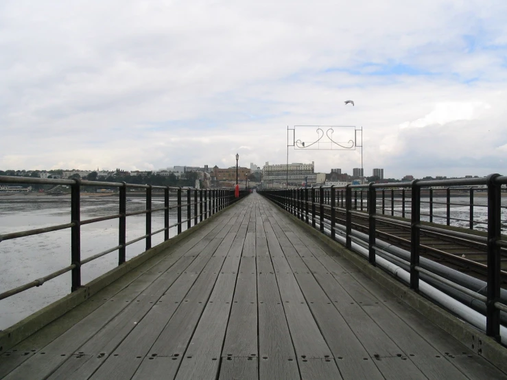 the view of a bridge going over water