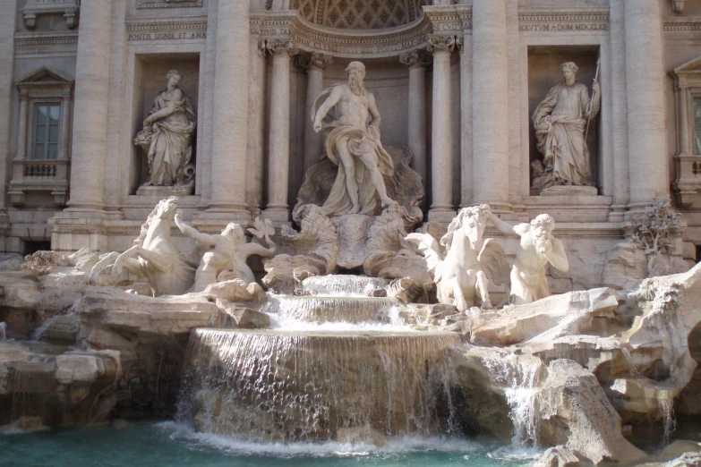 there are many different statues around the fountain