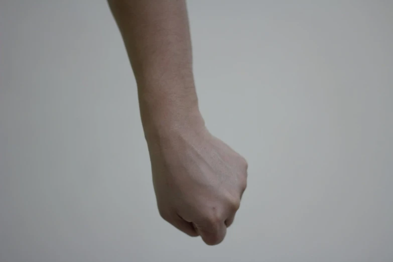 an image of a hand holding soing white