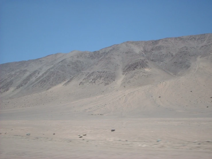 the hills that surround a desert range under a clear blue sky