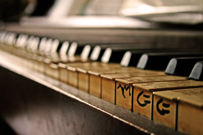 the keys on an old, broken, wooden piano