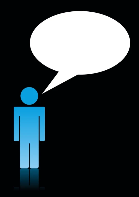 a man is standing with his head down in front of an empty speech balloon