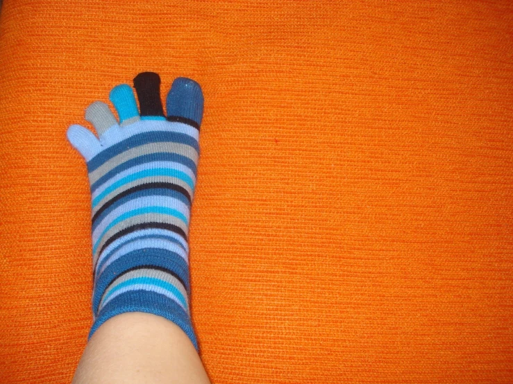 a person has his feet wrapped in colorful socks