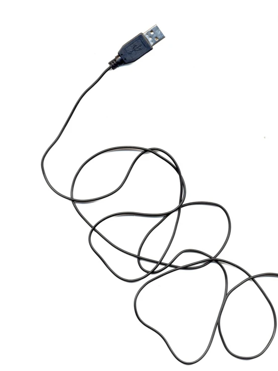 a tangle of black cords connected to a charger