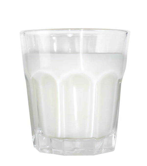 a clear glass with milk in it