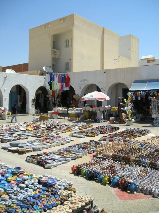 the street has many shoes outside on display