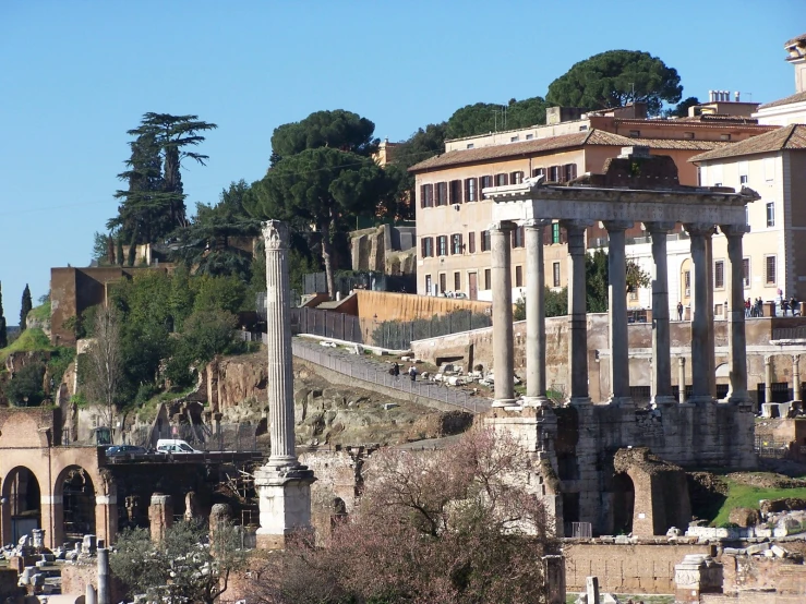 a city with roman ruins and trees