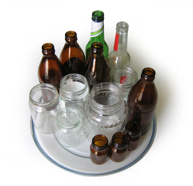 the glass bottles and other condiments are arranged in a circular