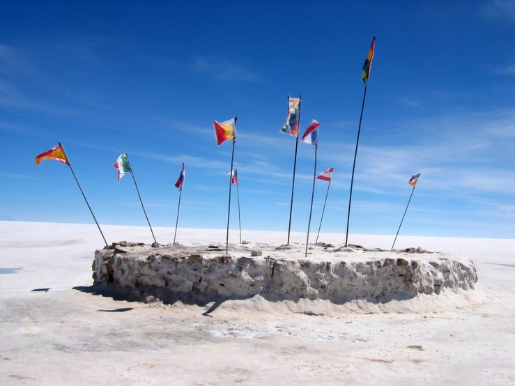 the poles are holding flags and flags in each others'posts