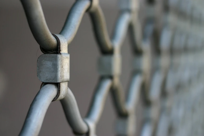 an abstract po of a fence with metal lines