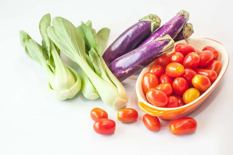 many different colored vegetables are in small bowls