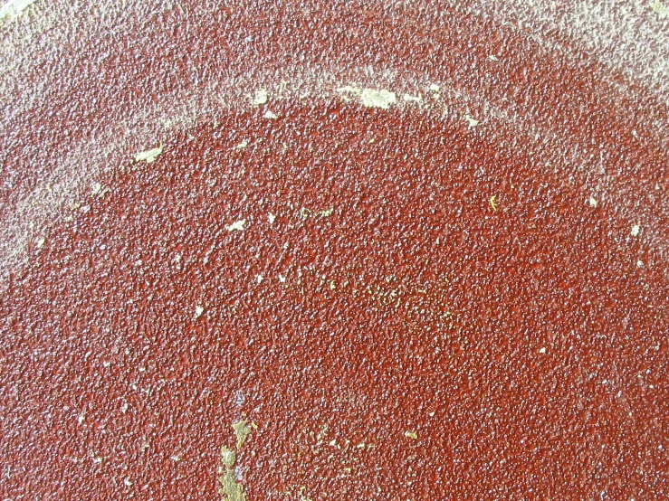 a close up of a red street sign in a parking lot