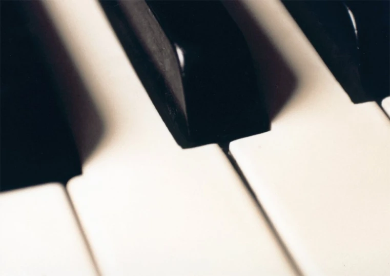 an angled picture of an abstract image of a piano keyboard