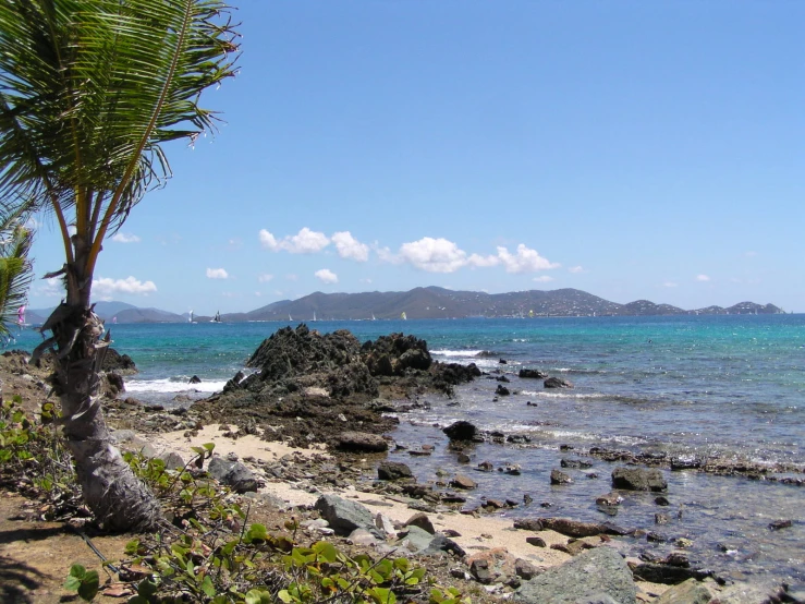 a view of some rocks that is near the water