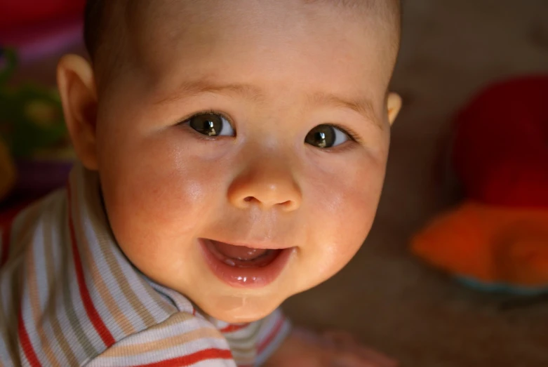 a young child standing in the floor with one eye on his face