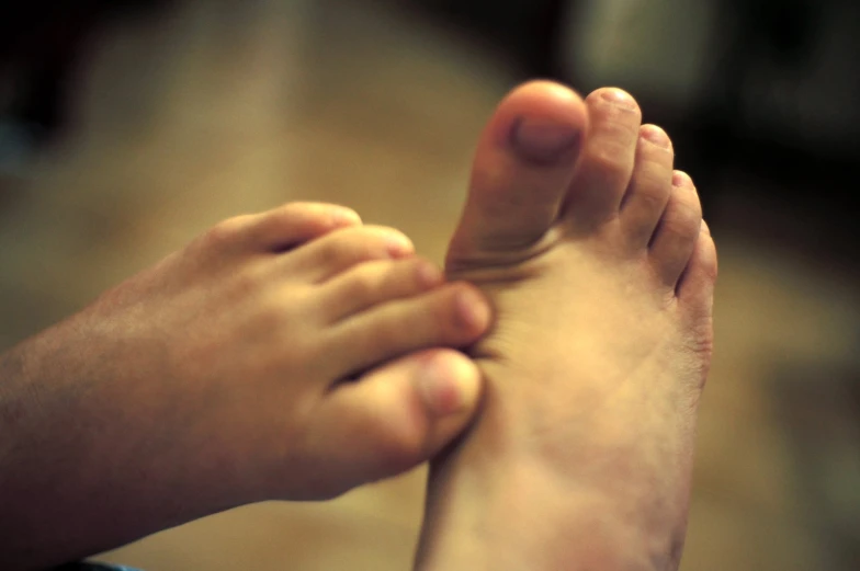 a person is putting their foot up to show the inside