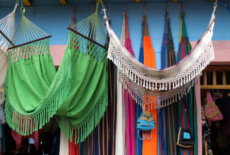 a variety of colorful tassels hanging from hooks