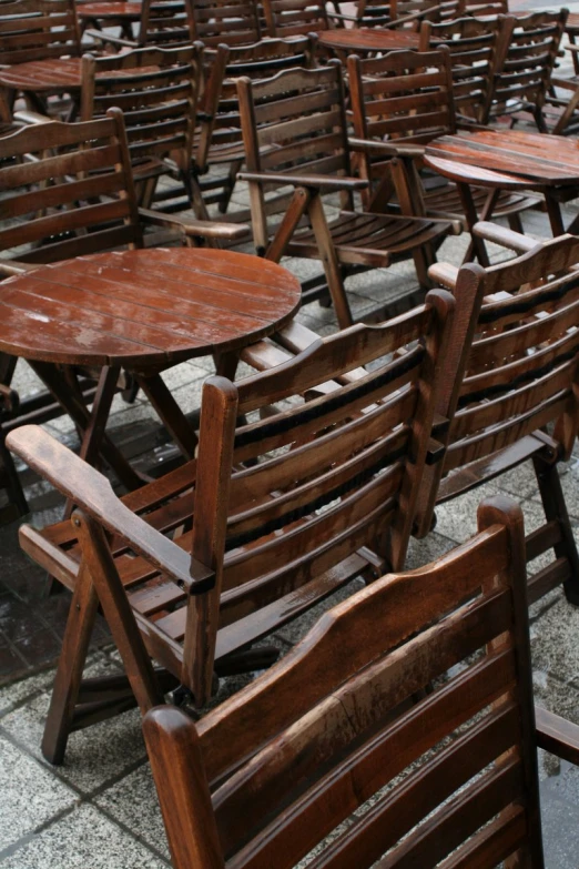 several tables and chairs with tables attached to them
