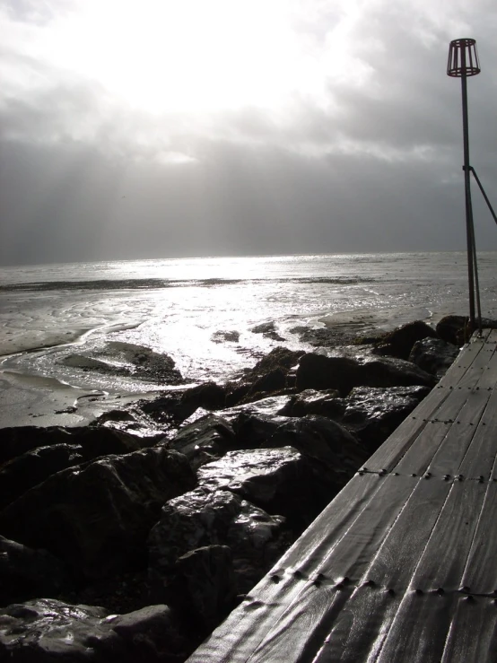 a sunlit scene with a boat dock in the foreground