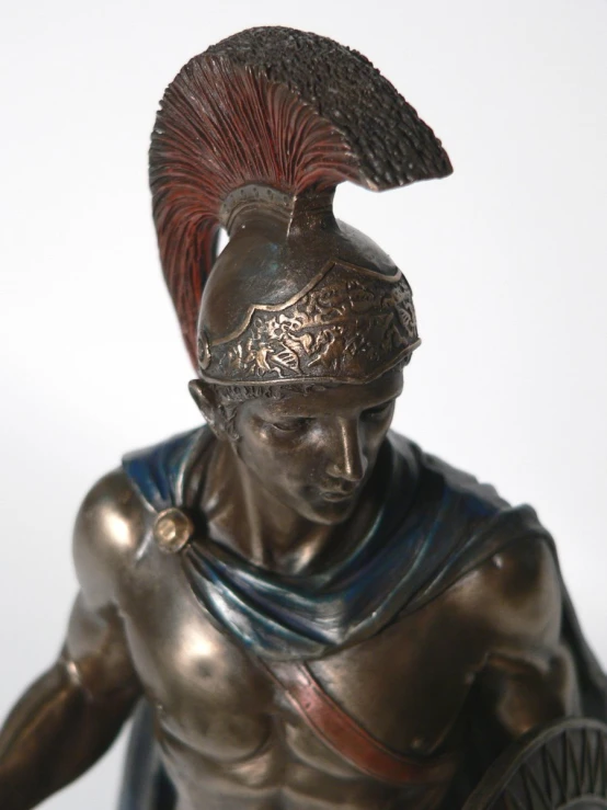 a bronze statue of a roman warrior