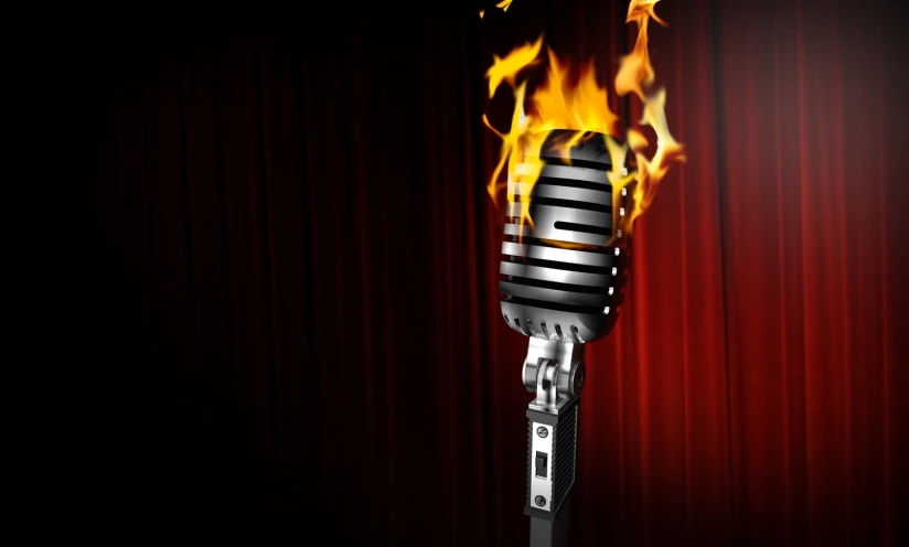 a mic on fire with a red curtain behind it