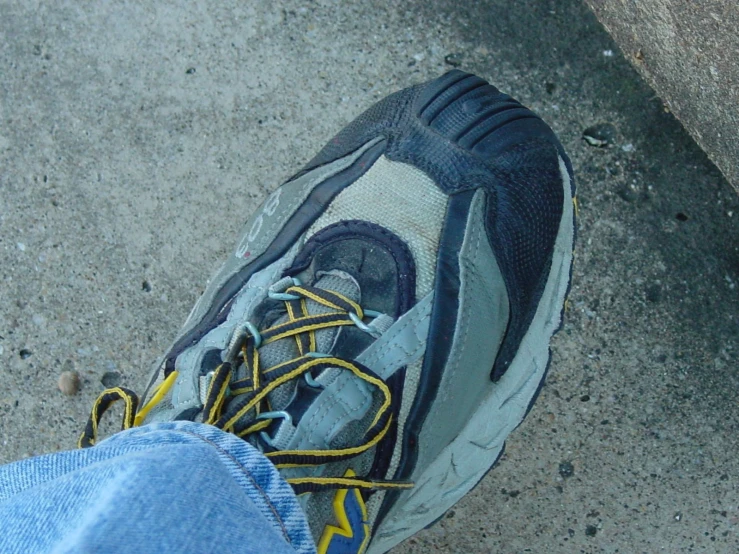a close up of the shoes worn by someone on the ground