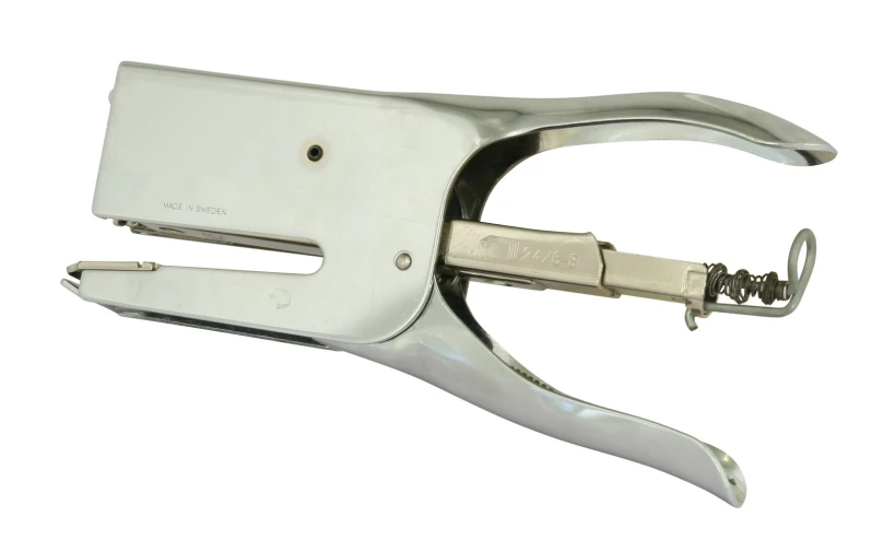 a silver stapler with a metal hook in it