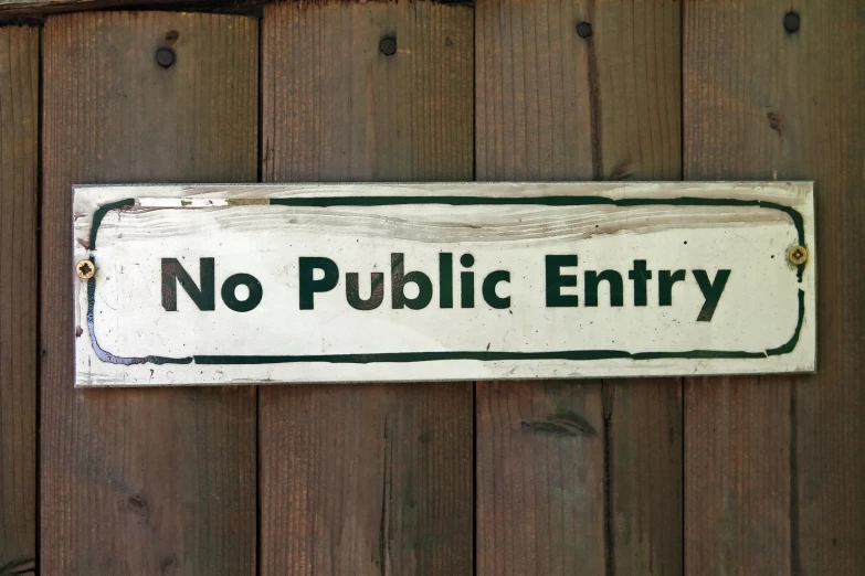 there is a sign on the wall that says no public entry