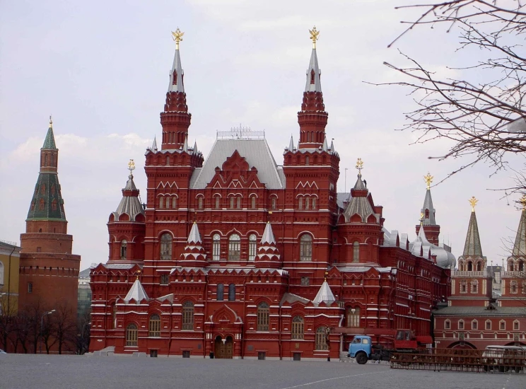 a large red building with some towers and spires