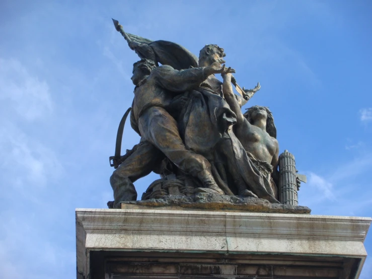 an image of a sculpture on a tower